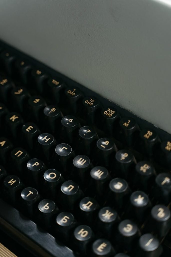 Close-up view of vintage Russian typewriter keys in a still life composition.